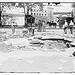 Damage by burst main, 129th St. (LOC)