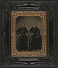 [Unidentified sailors in Union uniforms with American flag in front of painted backdrop showing ship deck with Monitor class ship in the distance] (LOC) by The Library of Congress