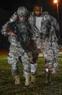 Spc. Jeremy Shivick moves a patient to the casualty collection point