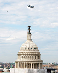 Shuttle Discovery flying past the U.S. Capitol Dome