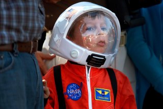 Photo: Photo: Allen J. Schaben / Los Angeles Times

Lucas Ferrer, 4, of La Mirada, looks out his space helmet at the Space shuttle Endeavour at the intersection of Manchester Blvd. and Crenshaw Drive.