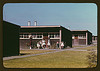 Families of migratory workers in front of their row shelters, FSA ... labor camp, Robstown, Tex. (LOC) by The Library of Congress