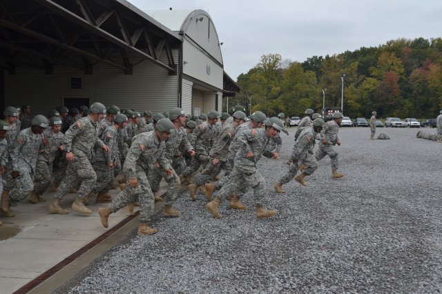Soldiers with the 159th Combat Aviation Brigade, along with others with the 101st Airborne Division (Air Assault), run to their respective places for a formation, Oct. 12, 2012, at the Sabalauski Air Assault School at Fort Campbell, Ky. The grueling 10-day course, teaches sling-load operations, rappelling and fast-rope techniques as it challenges Soldiers' levels of discipline and their physical and mental capabilities.