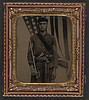 [Unidentified soldier in Union sergeant uniform and sash with Model 1840 non-commissioned officer's sword, revolver, cap box, and knife in front of American flag] (LOC) by The Library of Congress