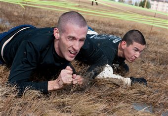 Airmen sling mud for Energy Action Month