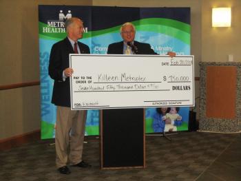 Carter presents check to Killeen Metroplex Hospital