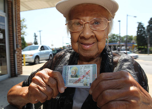 Viviette Applewhite, 93, holds up the temporary photo ID she was able to obtain from the Pennsylvania Department of Transportation. A permanent one will be mailed to her within 15 days.