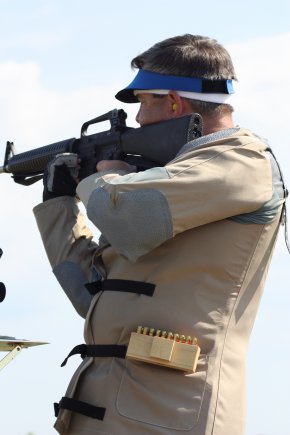 Rob Harbison, a contractor supporting small caliber ammunition capability development at Fort Benning, Ga., fires the Enhanced Performance Round from his weapon while in the standing position at 200 yards.