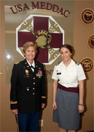 Col. Beverly Land, Keller Army Community Hospital commander, and Firstie Anna Stein pose for a photo before the Richard M. Mason Memorial Award Ceremony, May 22, 2012, at West Point, N.Y.  The Manson Award honors the cadet with the highest grade point average who is entering medical school. The future Medical Corps officer will be graduating West Point Saturday and continue her education at the School of Medicine at Yale University.