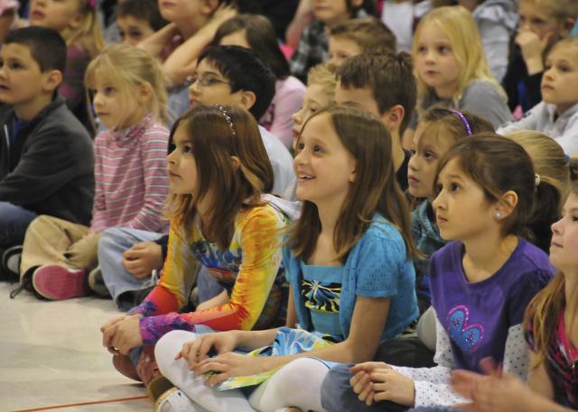 Mackenzie Frost and her classmates watch the Fox 6 Milwaukee Video that tells the story of her cookie drive.