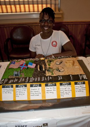 FORT BRAGG, N.C." Natasha McDonald, an Army spouse and owner of Kakes by McTasha, was the first place winner for the first ever Fort Bragg Army Birthday Cake Competition held yesterday at the Fayetteville Veterans Affairs Medical Center auditorium. The competition was designed to help celebrate the Army's 237th birthday on June 14 as well as to thank Soldier's past and present for their service and sacrifice to our country. "It's a pretty awesome feeling," McDonald said about winning. "I wanted to do something that showed that I'm proud of what my husband does, and that he is proud of what he does in the Army." (U.S. Army photo by Sgt. Jessica M. Kuhn/XVIII Abn. Corps PAO)