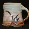 Wood fired ceramic mug with green and pink salt glaze by Elmer Taylor.