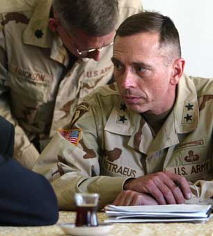 Maj. Gen. David Petraeus, right, holding a meeting with community leaders in Mosul, Iraq on April 30, 2003. (Photo: Ruth Fremson / The New York Times) 