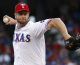 Scott Feldman of the Texas Rangers throws against the Boston Red Sox at Rangers Ballpark in Arlington on July 23, 2012 in Arlington, Texas. (credit: Rick Yeatts/Getty Images)