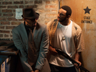 R. Kelly (left) as Sylvester, and Eric Lane as Twan, in Trapped in the Closet, which relaunched with new chapters last week on IFC.