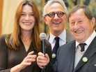 France's former first lady Carla Bruni-Sarkozy, auctioneer Francois de Ricqles and former soccer coach Guy Roux preside over the 152nd Hospices de Beaune wine auction Sunday in Beaune, France. The charity auction raised an all-time high of $7.5 million, which goes to area hospitals.