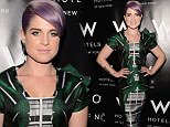 It's an urban jungle! Kelly Osbourne shows off her slimline figure in a daring structural print dress