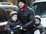 He must have good balance! Liev Schreiber takes BOTH his sons for a ride on his bike