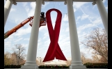 AIDS Ribbon Is Hung From The White House