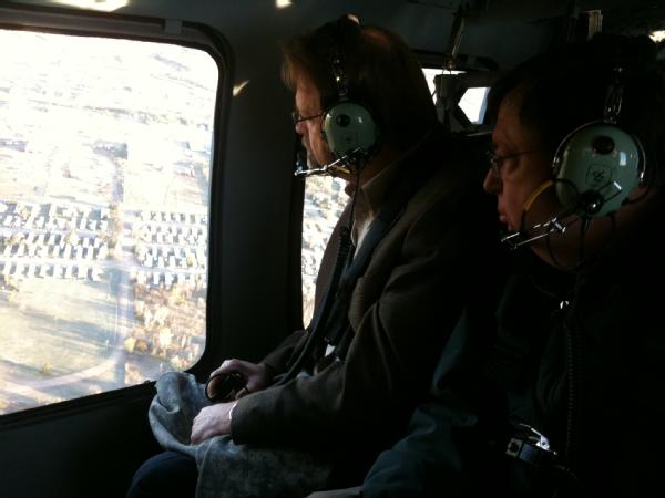 David Miller, Associate Administrator, Federal Insurance and Mitigation Administration and William Carwile, Associate Administrator, FEMA Response and Recovery survey ongoing recovery efforts in Minot.