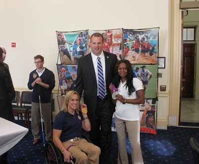 Photo: U.S. Paralympics medal winners visiting DC today share a moment with Committee member and former Philadelphia Eagles' star Congressman Jon Runyan.