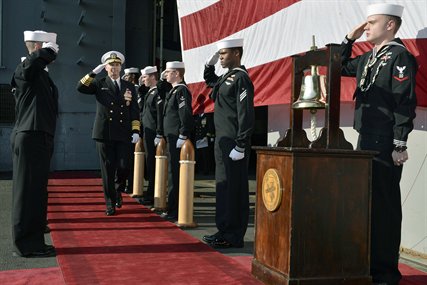 USS Enterprise sailors ring a board Navy Adm. Jonathan Greenert, chief of naval operations, during the ships inactivation ceremony in Norfolk, Va., Dec. 1, 2012. The Enterprise was commissioned Nov. 25, 1961 as the first nuclear-powered aircraft carrier. 