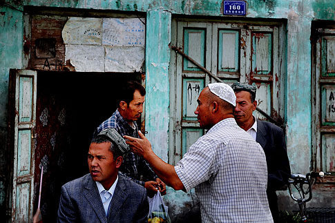 image: Uighur men are seen in the old town Kashgar district, Xinjiang province, China, Sept. 5, 2009.