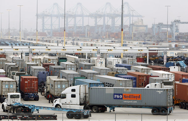 Work resumed at the ports of Los Angeles and Long Beach on Wednesday after a strike that crippled America's busiest shipping hub for more than a week was resolved.