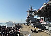 Attendees observe the inactivation ceremony of the aircraft carrier USS Enterprise (CVN 65). 