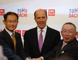 Yukihiro Nitta of Fast Retailing Co. Ltd, Ambassador John Roos, and Fast Retailing Chairman, President and CEO Tadashi Yanai