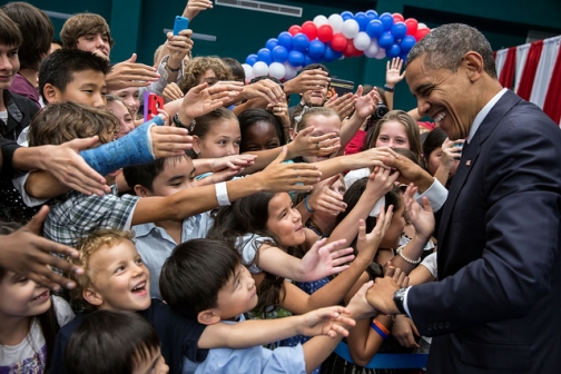 President Obama greets the children of U.S. embassy staff during a reception