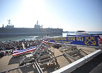 Sailors, veterans and guests observe the inactivation ceremony of the aircraft carrier USS Enterprise (CVN 65).