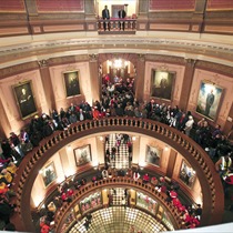 People line up to try to enter the House Chamber where a vote is scheduled to take place on Right-to-Work legislation at the Michigan State Capitol December 11, 2012 in Lansing, Michigan. Republicans control the Michigan House of Representatives, and Michigan Gov. Rick Snyder has said he will sign the bill if it is passed. The new law would make requiring financial support of a union as a condition of employment illegal. (Bill Pugliano, Getty Images)