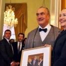 Photo: U.S. Secretary of State Hillary Rodham Clinton is presented with a photograph of a meeting of Secretary Clinton and President Bill Clinton with the late Czech President Vaclav Havelwith by Czech Foreign Minister Karel Schwarzenberg in Prague, Czech Republic, December 3, 2012. [State Department photo/ Public Domain]
