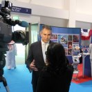 Photo: Under Secretary of Commerce for International Trade Francisco J. Sanchez is interviewed at the U.S. Embassy booth at the Global Entrepreneurship Summit (GES) in Dubai, United Arab Emirates, December 11, 2012. [State Department photo/ Public Domain]