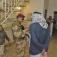 Iraqi army soldiers inspect houses and identification cards