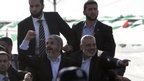 Khaled Meshaal (L), with senior Hamas leader Ismail Haniyeh (R) upon his arrival in the southern Gaza Strip December 7, 2012.