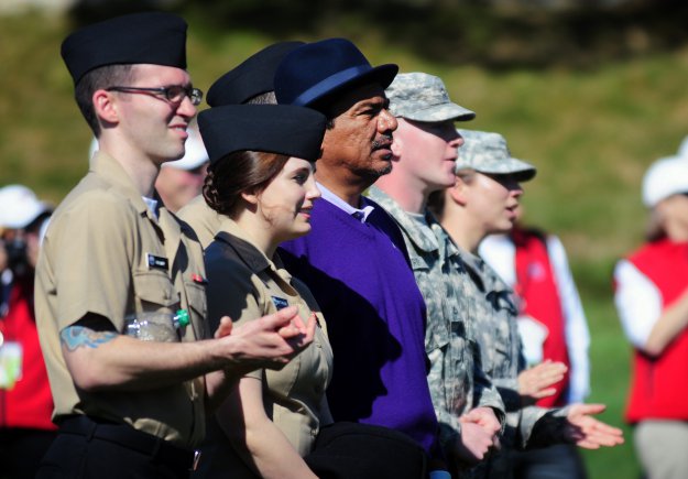 PEBBLE BEACH, Calif. - Comedian George Lopez watches the action with service members from the Defense Language Institute Foreign Language Center during the 3M Celebrity Challenge on Feb. 8. The Celebrity Challenge is a popular event to raise money for charities and coincides with Military Day as part of the week long AT&T Pebble Beach National Pro-Am golf tournament.