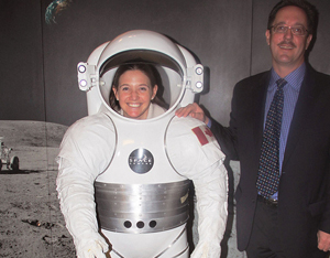 U.S. Consulate General Vancouver public affairs officer Jeanne Briganti gets ready for a space food feast with H.R. MacMillan executive director Rob Appleton. (Credit: US Consulate Vancouver)