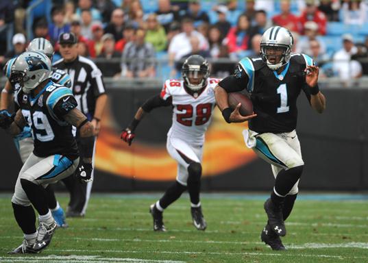 Cam Newton blasts off for a 72-yard touchdown run, giving Panthers a 23-0 lead. (AP photo)