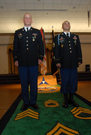 Pvt. 1st Class Thomas Hauser and Staff Sgt. Jonathan Castillo, both representing XVIII Airborne Corps, stand tall as winners of the 2011 Forces Command Best Warrior Competition at Fort Hood, Texas, July 28, 2011.