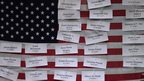 Names of Newtown school shooting pinned to US flag