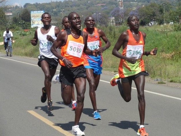 Hosea Nailel (5039), Julius Muriuki, (5103) and Peter Chesang (5106) joined over 2,000 participants in Nakuru Town in a race that aimed to bridge ethnic divisions ahead of this country’s March 2013 elections. Credit: Peter Wahwai/IPS