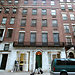 The town-house garage at 44 East 71st Street, as seen today. The elegant hinged cast-iron door to the left of the entrance was recently restored; its twin is stationary.