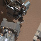 This image from NASA's Curiosity shows a scoop full of sand and dust lifted by the rover's first use of the scoop on its robotic arm. In the foreground, near bottom of this image, the bright object visible on the ground might be a piece of rover hardware.