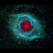 This infrared image from NASA's Spitzer Space Telescope shows the Helix nebula, a cosmic starlet often photographed by amateur astronomers for its vivid colors and eerie resemblance to a giant eye.