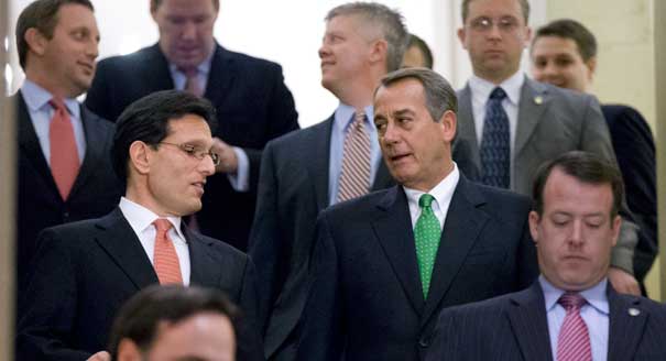 Speaker of the House John Boehner (center right), and House Majority Leader Eric Cantor (center left), walk down stairs to a second Republican conference meeting to discuss the 'fiscal cliff' bill. | AP Photo