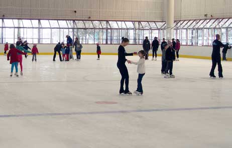 People ice skating at a DCR rink