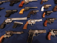 A table of illegal firearms confiscated in a large weapons bust in East Harlem are on display at a press conference on October 12, 2012 in New York City.  (Mario Tama / Getty Images)