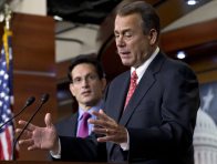 Speaker of the House John Boehner, R-Ohio, joined by House Majority Leader Eric Cantor, R-Va., left, speaks to reporters about the fiscal cliff negotiations at the Capitol in Washington, Friday, Dec. 21, 2012. (Photo by J. Scott Applewhite/AP Photo)